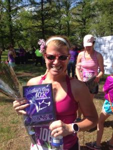 My wife with one of her awards (2nd place age group - Mother's Day 10K)
